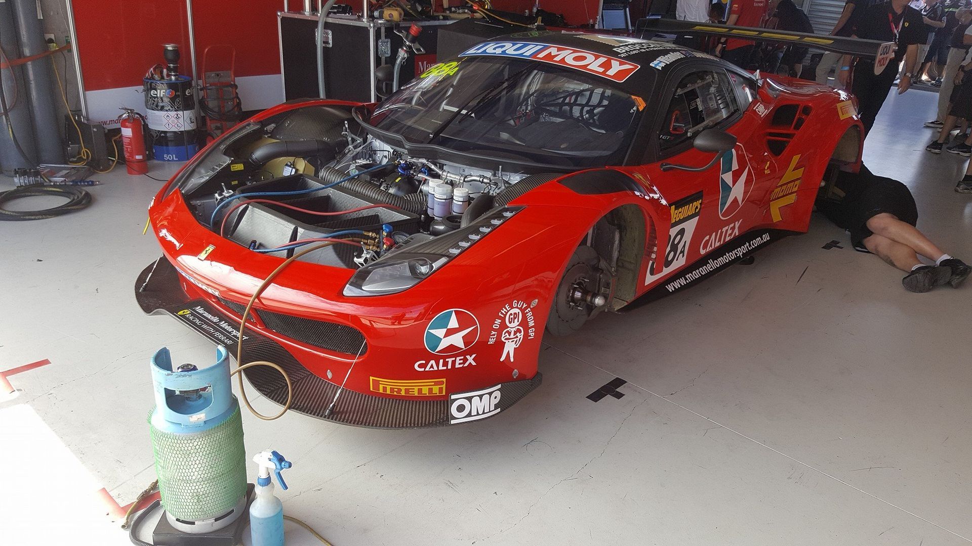 Red Race Car With Open Hood Being Worked on in a Garage — Auto Watt in Kelso, NSW