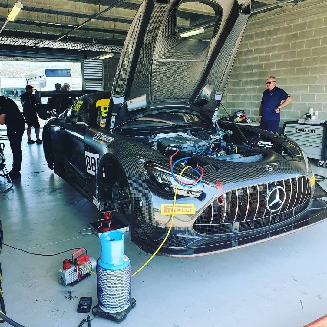 Car being worked on in a garage; hood and doors open — Auto Watt in Kelso, NSW