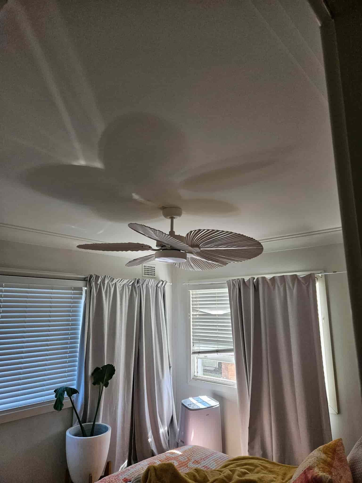 A Bedroom with A Ceiling Fan and A Bed  — KPJ Electrical In Charlestown, NSW
