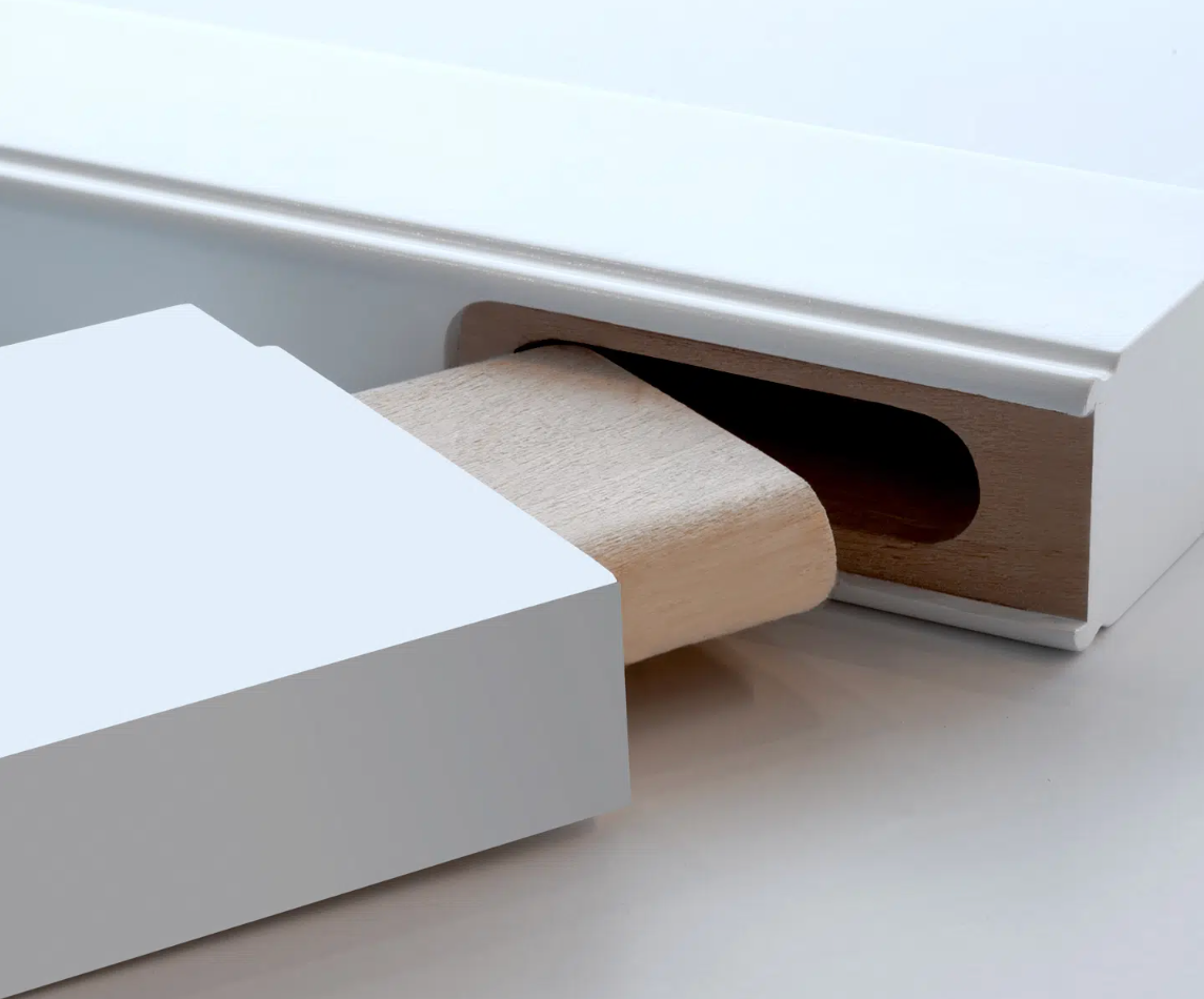 A white box with a piece of wood sticking out of it