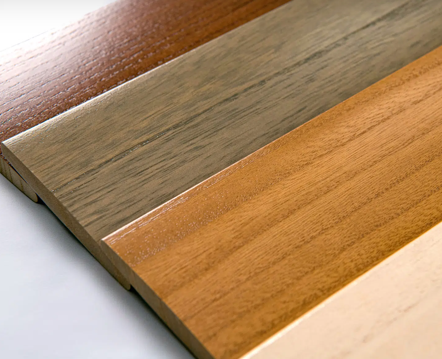 Three different types of wood are stacked on top of each other