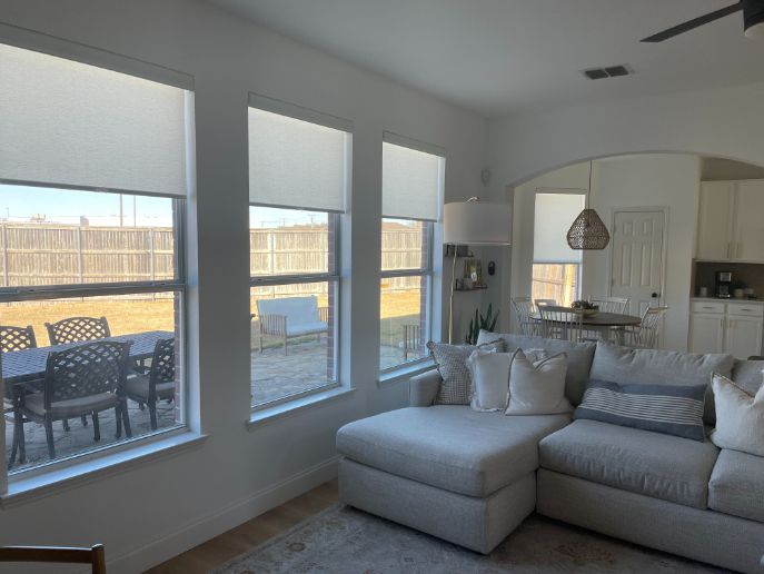 Love is Blinds TX - motorized roller shades in the living room.