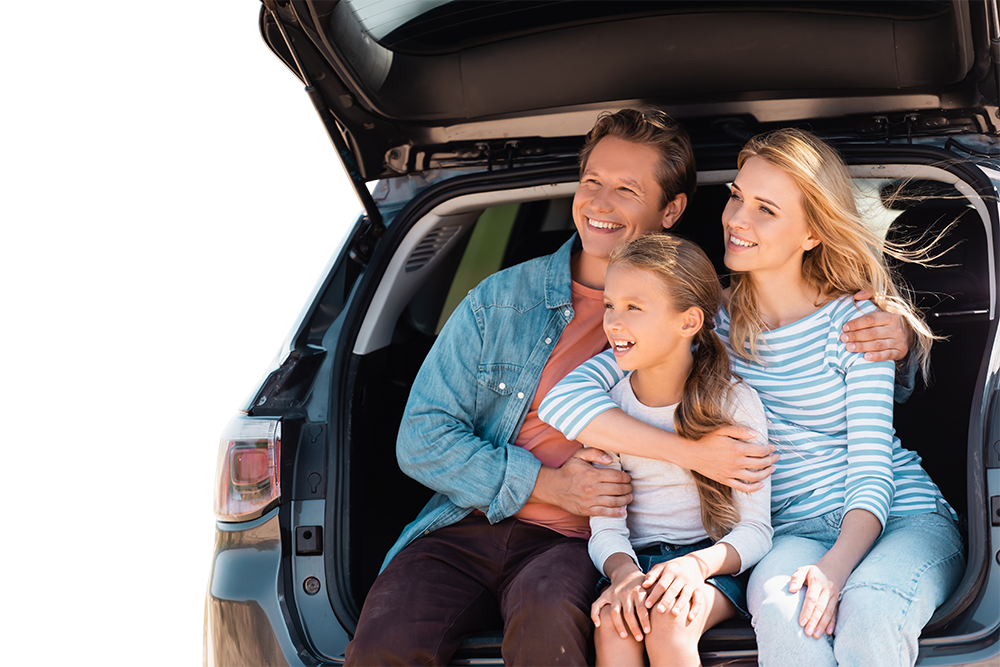 A family is sitting in the back of a car.