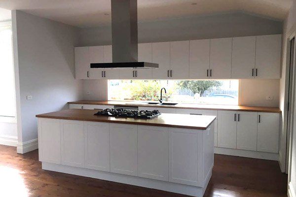 modern kitchen with white cabinets