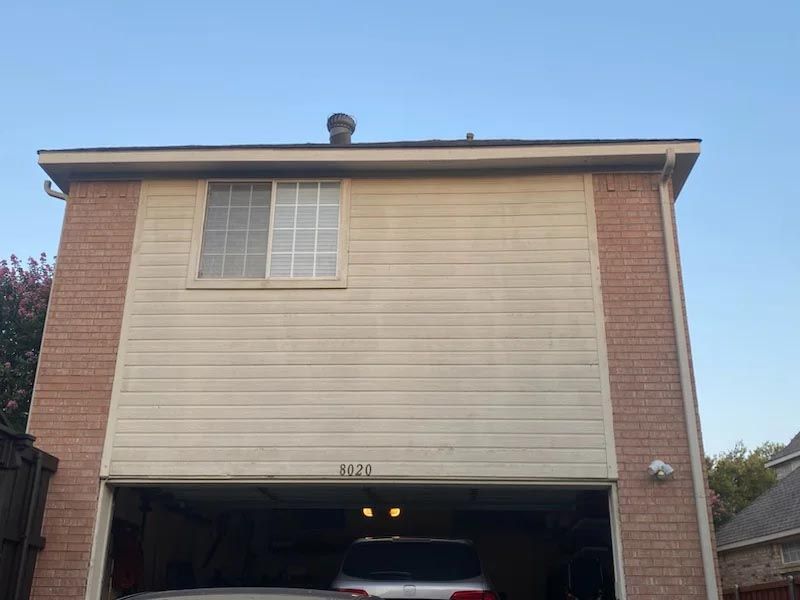 A car is parked in the garage of a house