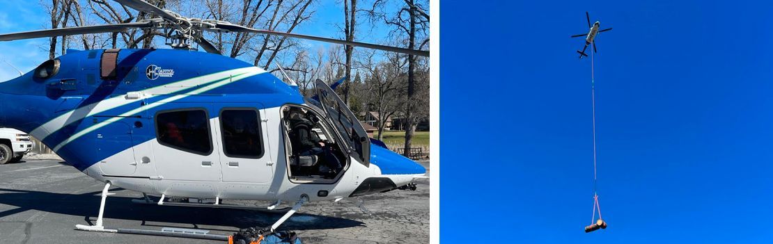 Helicopter with blue and white stripes; a helicopter with a cable suspended from the sky.