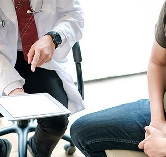 Doctor Holding Digital Tablet — Hickory, NC — Viewmont Urology Clinic, PA