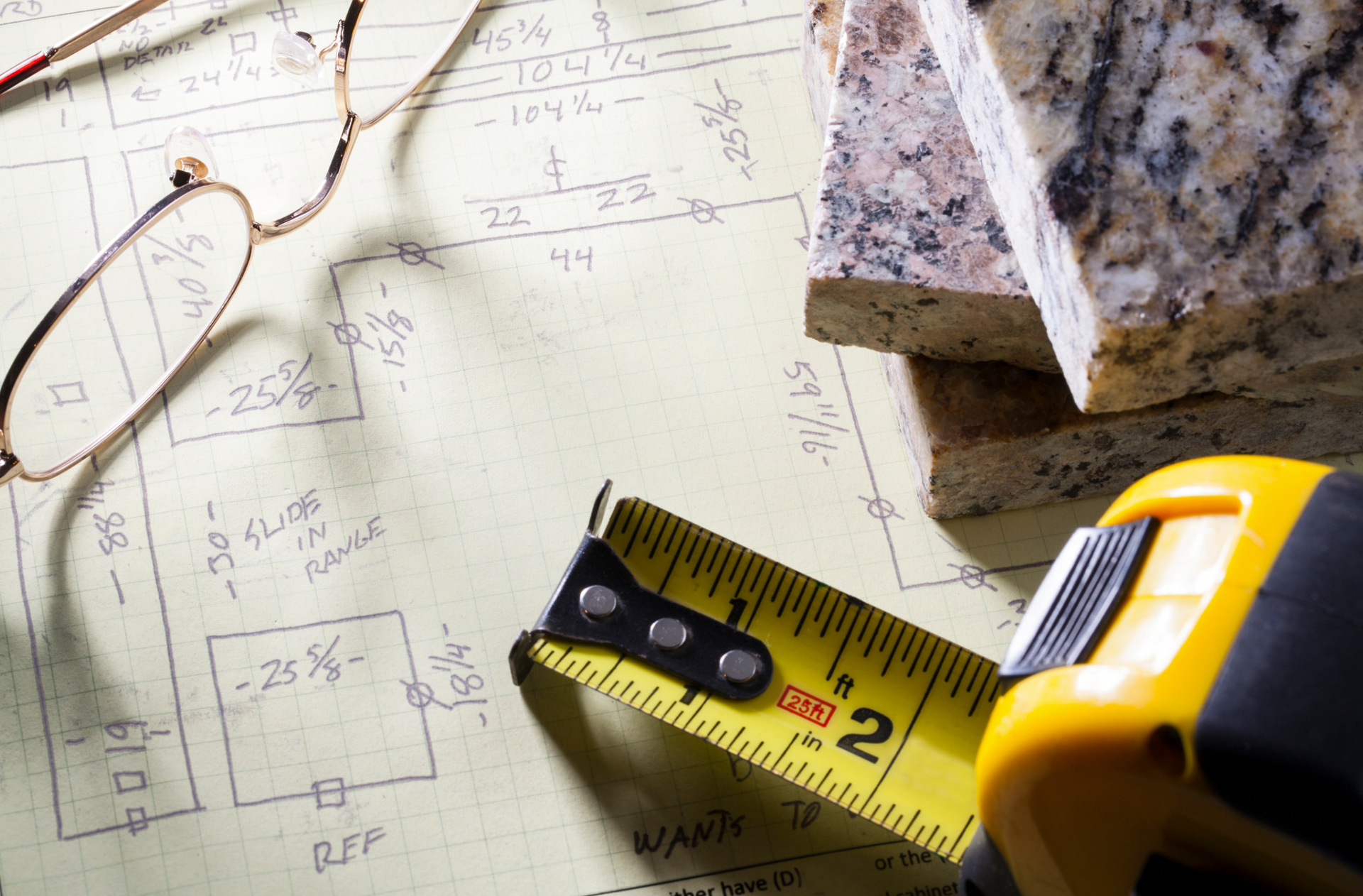 A yellow tape measure with the number 2 on it