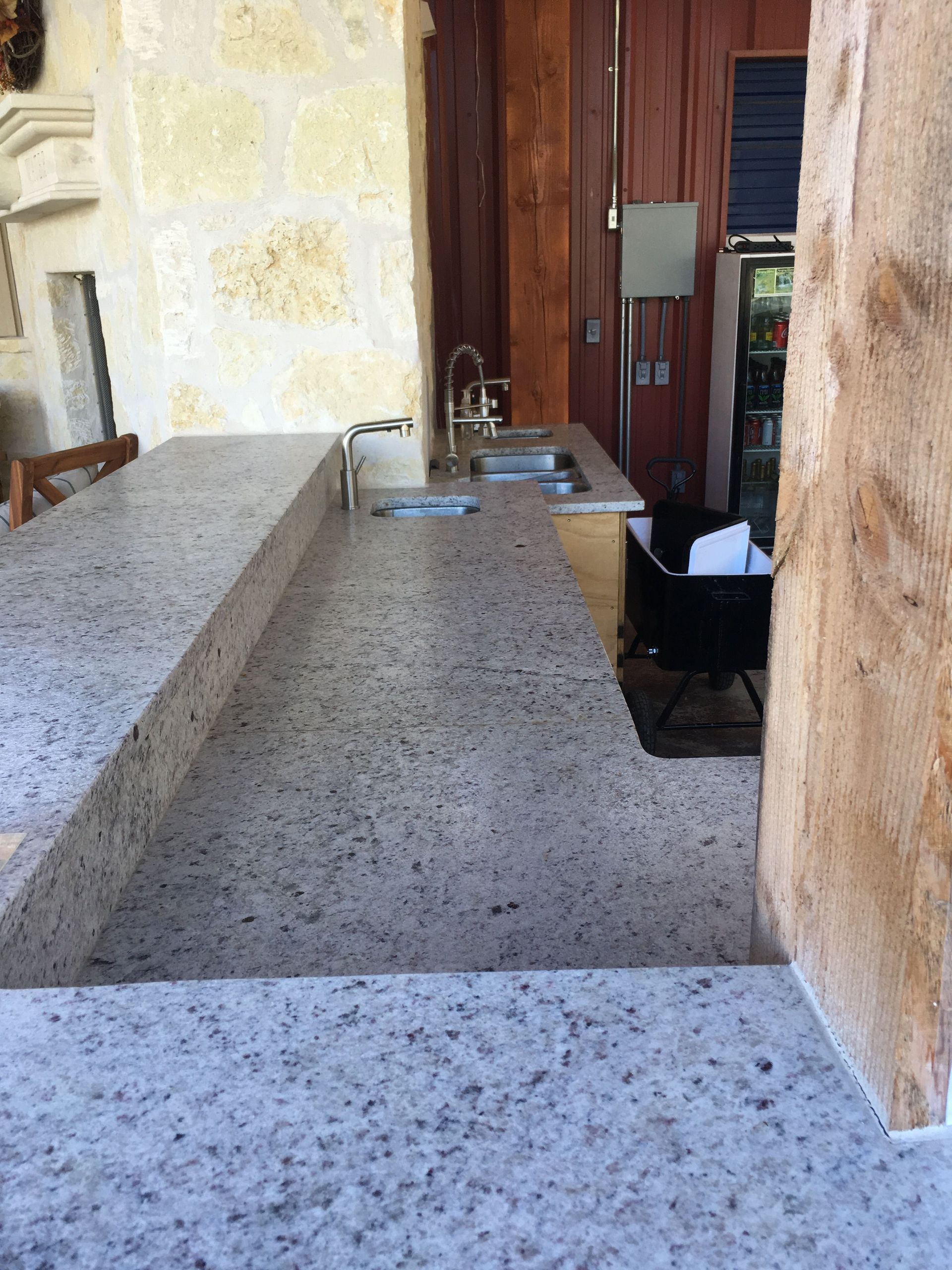 A kitchen with granite counter tops and a sink