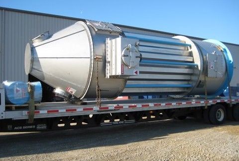 A large stainless steel cone on a semi truck