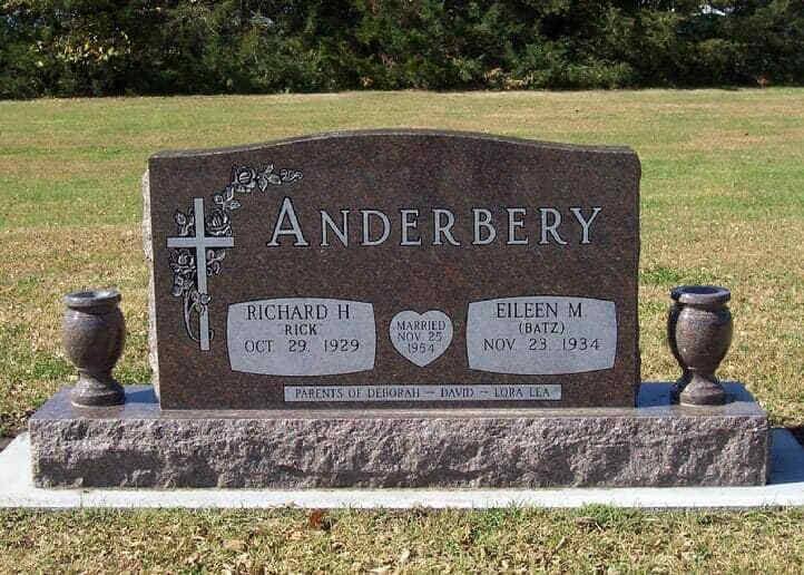Companion monument in mahogany granite with turned vases
