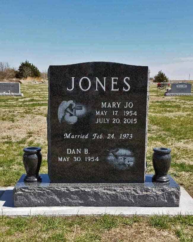 Companion monument in black granite with etchings and turned vases