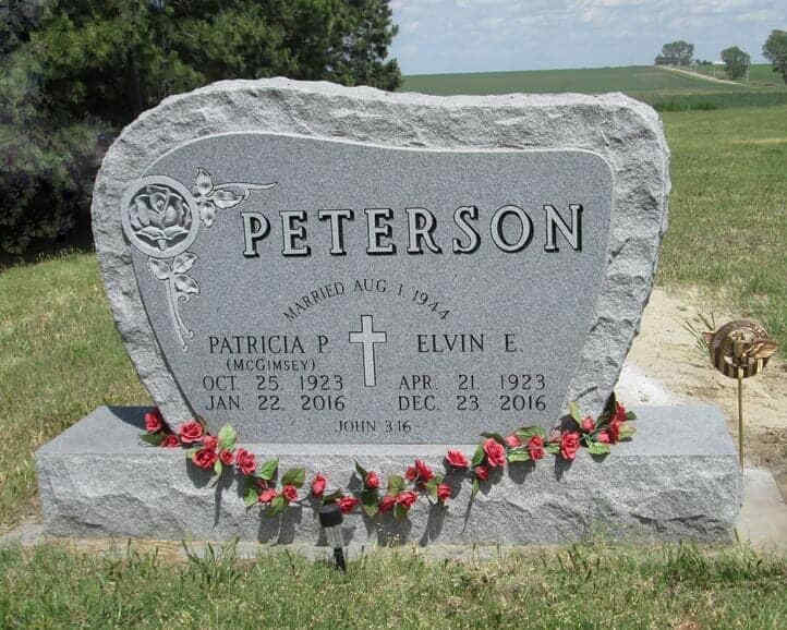 Companion monument in gray granite with shell rock border