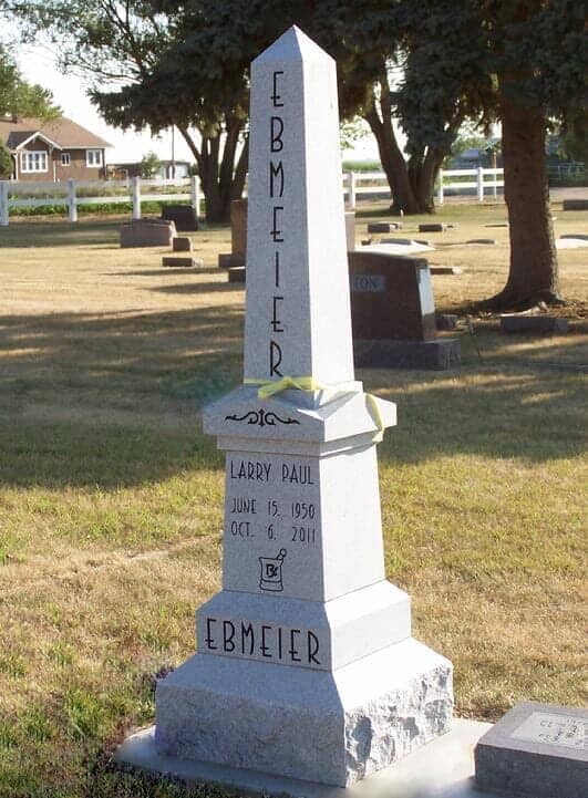 Oblisque monument in gray granite