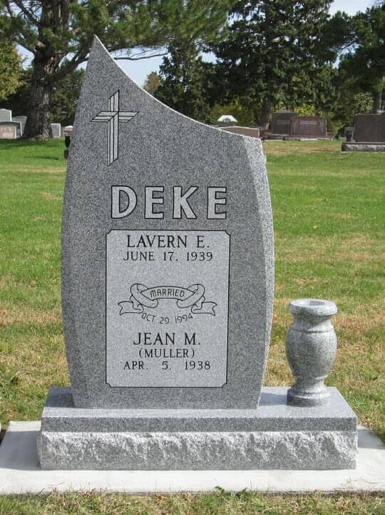 Companion vertical monument in gray granite with matching turned vase