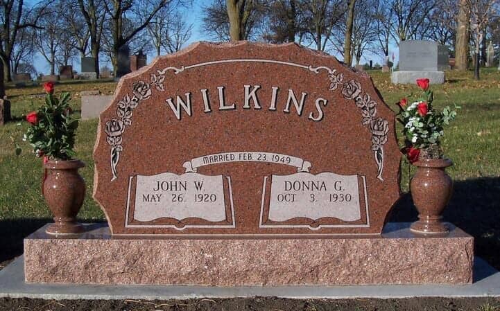 Scalloped companion monument in red granite