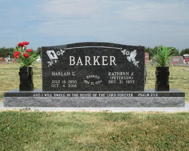 Companion monument in black granite with cross style vases