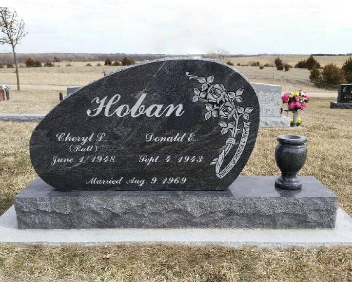 Companion monument in black granite with turned vase