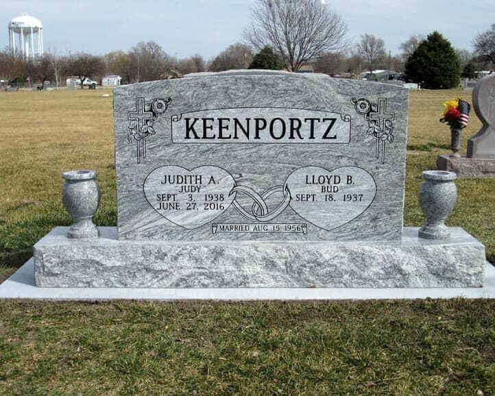 Companion monument in gray cloud granite with turned vases