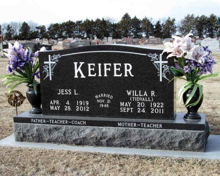 Companion monument in gold star granite with turned vases