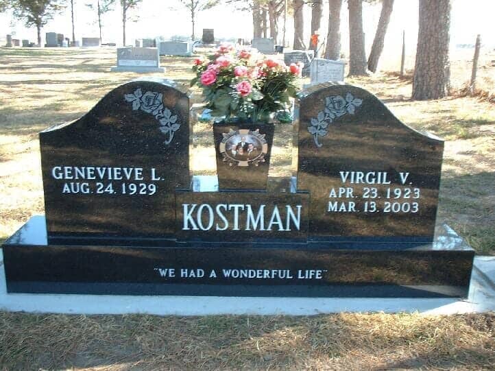 Companion wing monument in black granite with tapered vase