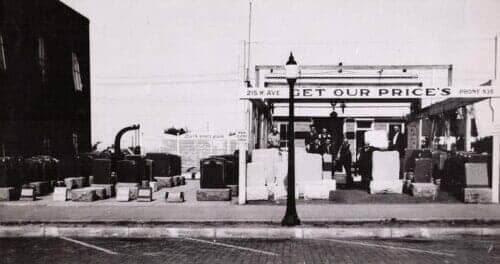 Store front 1934 J R Palmer in front center — About Our Memorials in Holdrege, NE