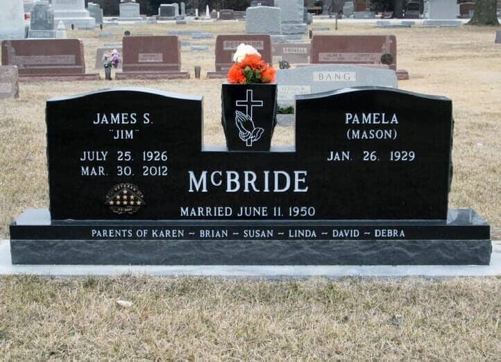 Companion monument in black granite with cut away area for tapered vase