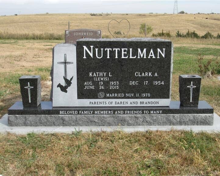 Companion monument in black granite with tapered vases