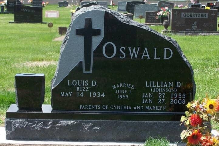 Rustic companion monument in black granite with tapered vase