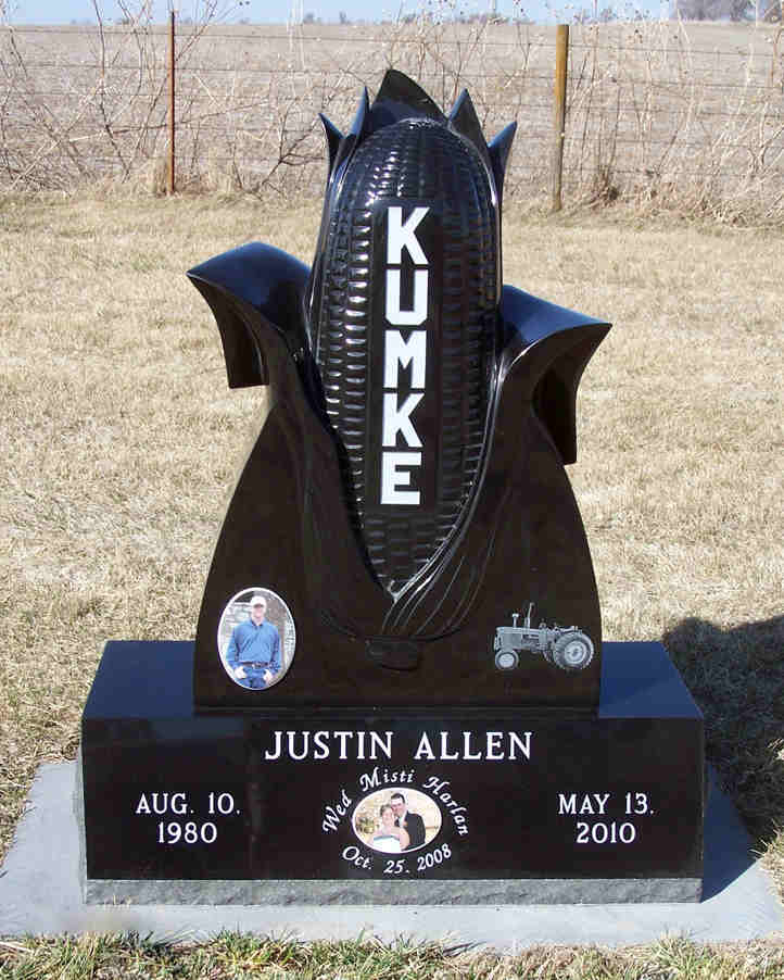 Custom monument in dimensional polished black granite with porcelain photos