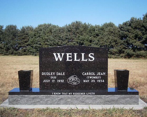Companion monument in gold star granite with matching tapered vases