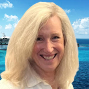 Eileen Murphy sitting at a desk at Land and Sea Travel