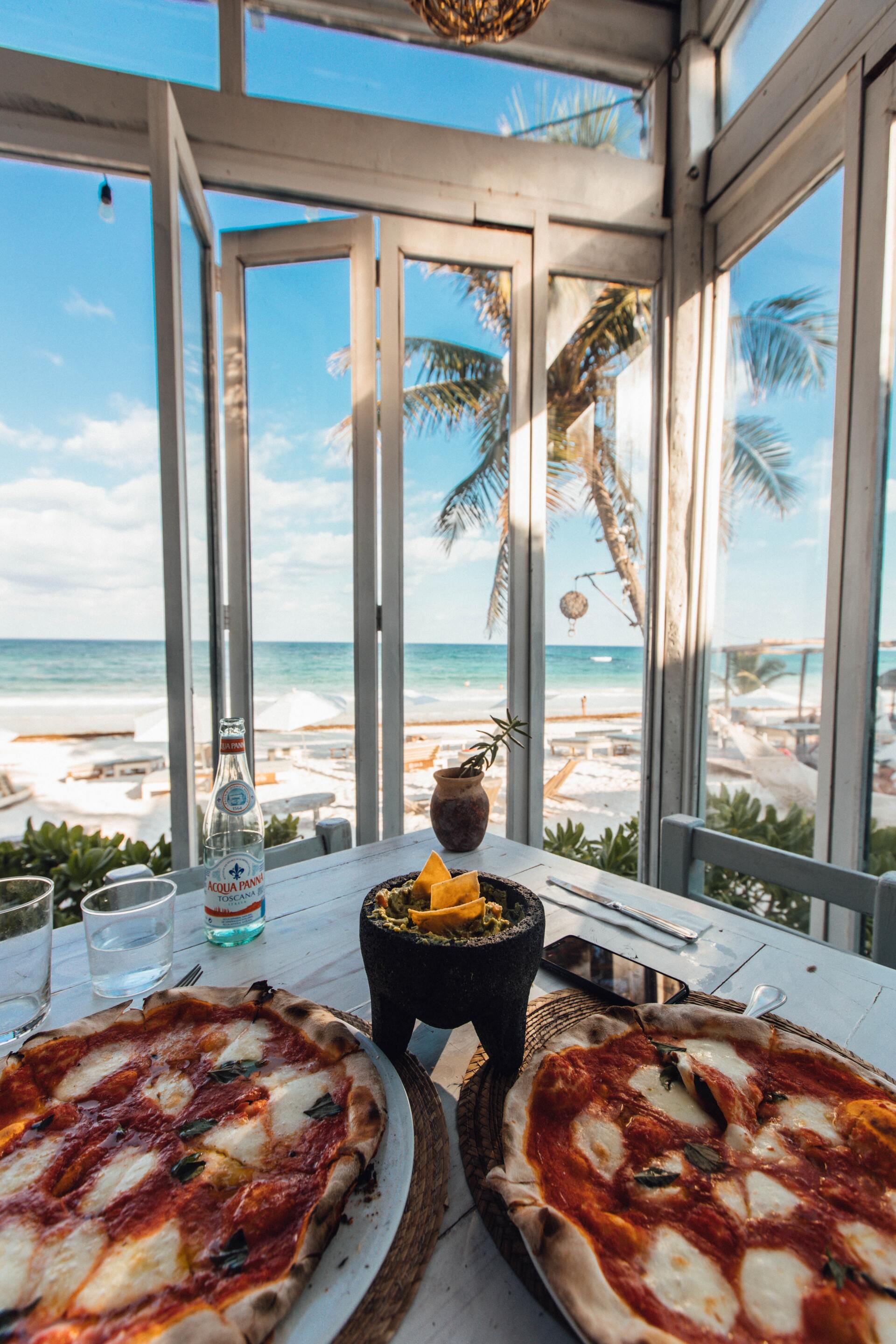 Land and Sea Travel Table with Pizza and beach view