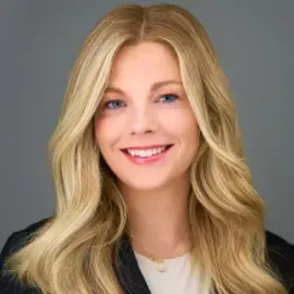 Kathryn Stansbury sitting at a desk at Land and Sea Travel