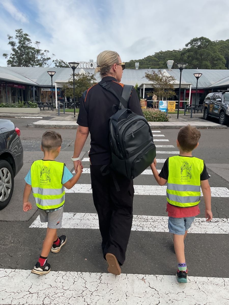 A Woman and Two Boys Are Crossing a Street Holding Hands — Kinburra Preschool (Kincumber) in Kincumber, NSW