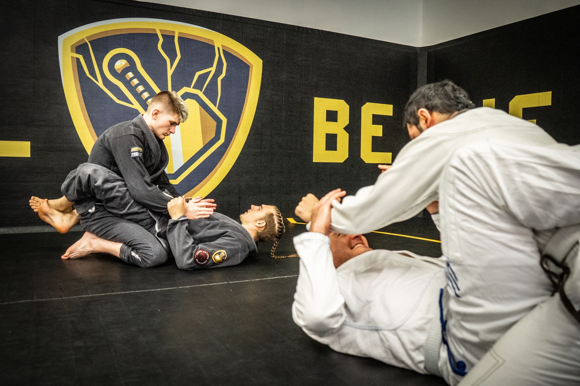Students practicing Brazilian Jiu-Jitsu and Muay Thai for self-defense at Hammer Sports and Performance in Hazlet NJ.