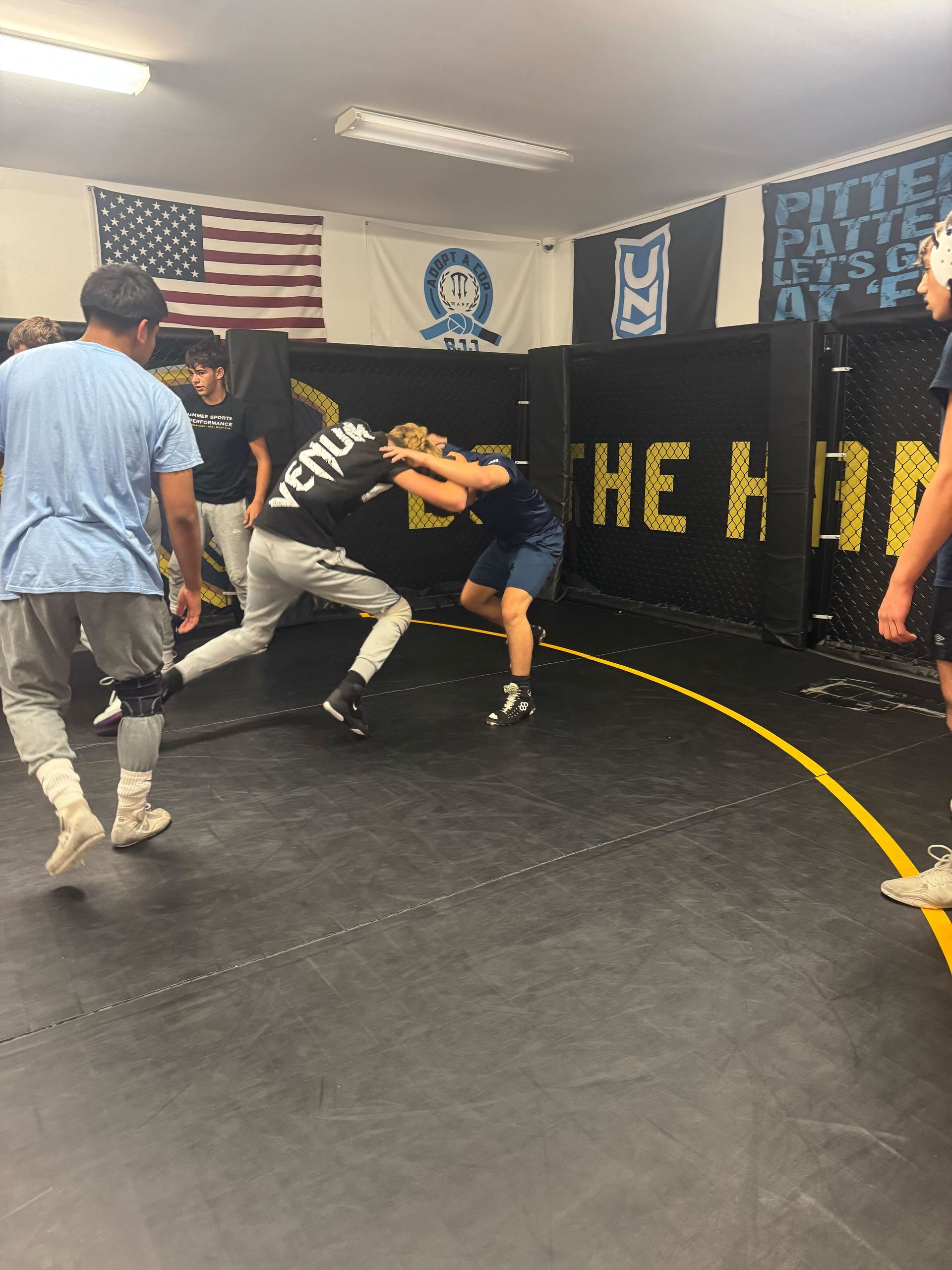 Adults practicing Jiu-Jitsu sparring at Hammer Sports and Performance in Hazlet, NJ.