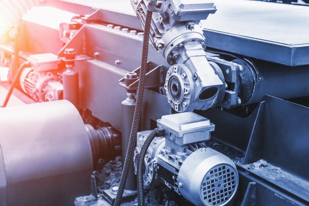A Close Up Of A Conveyor Belt With A Motor Attached To It — Real Engineering In West Gosford, NSW