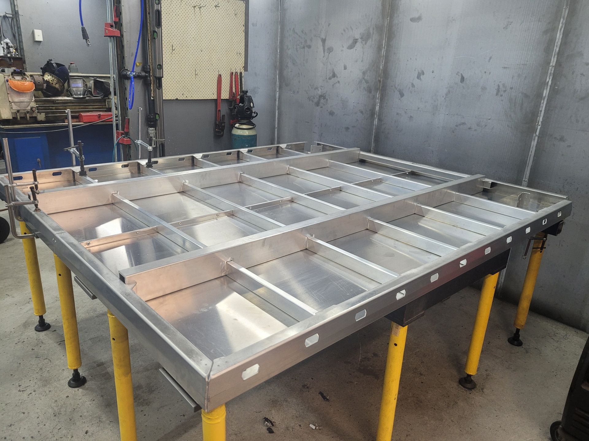 A Machine Is Cutting A Piece Of Metal With Sparks Coming Out Of It — Real Engineering In West Gosford, NSW