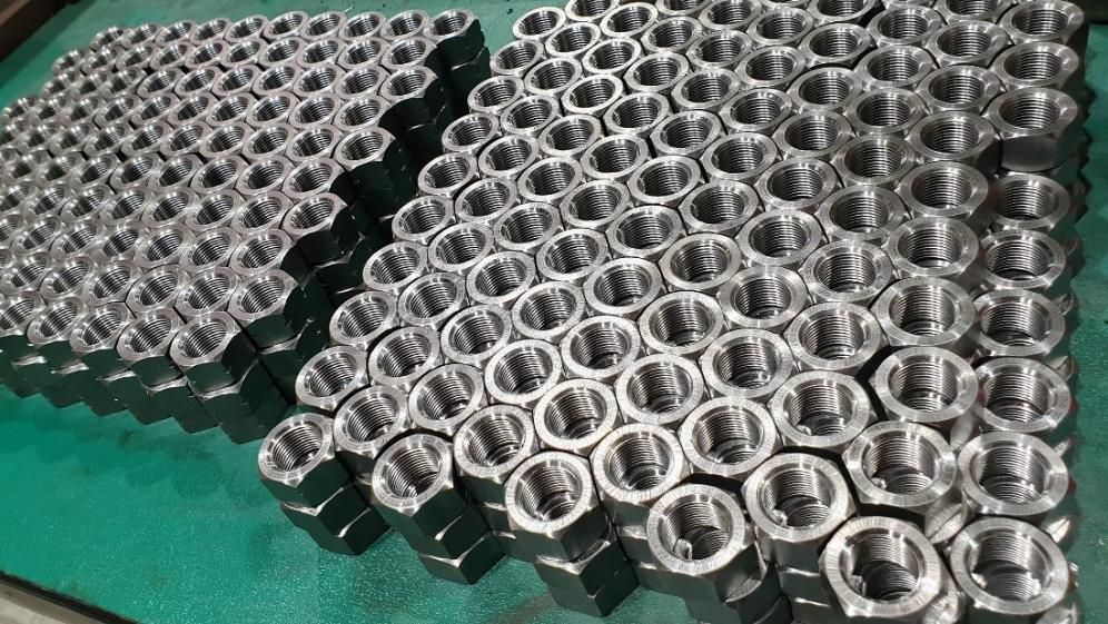 a Bunch of Nuts Are Stacked on Top of Each Other on a Table — Real Engineering In West Gosford, NSW