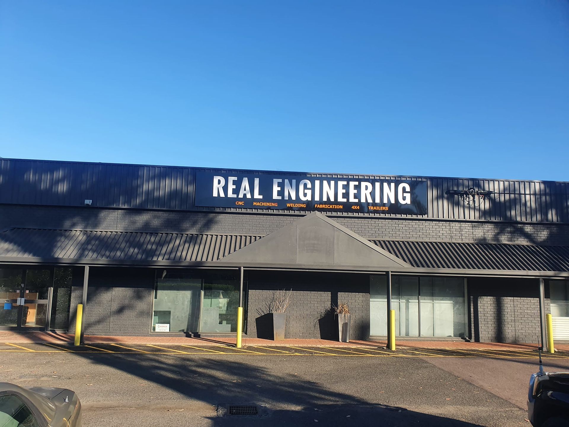 A Person Is Fixing A Brake Disc On A Car — Real Engineering In West Gosford, NSW