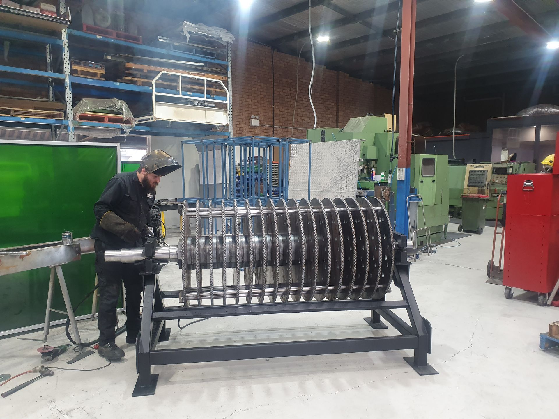 A Machine Is Cutting A Piece Of Wood With A Laser — Real Engineering In West Gosford, NSW