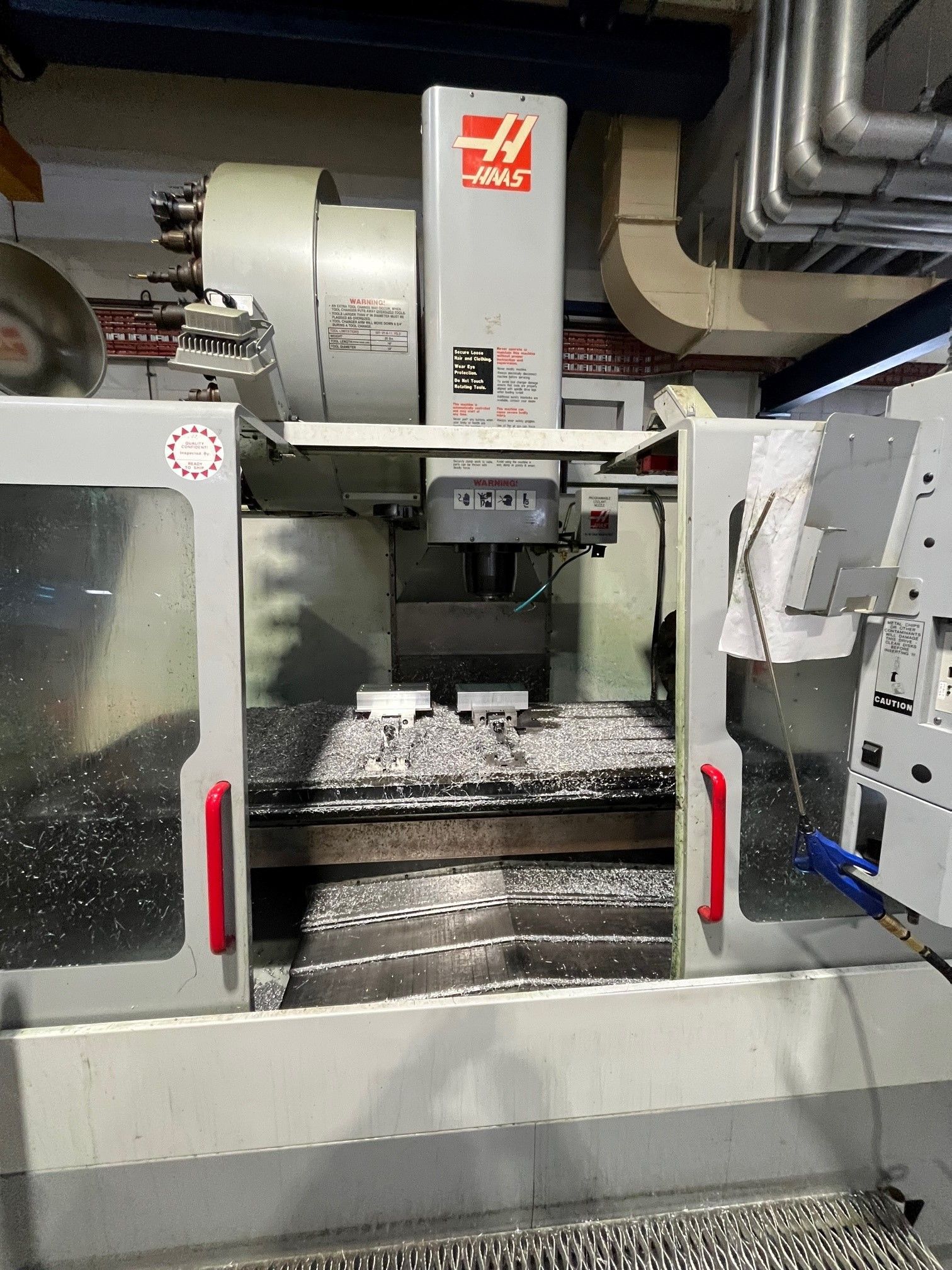 CNC Milling Machine With Open Doors And Metal Chips Inside — Real Engineering in Seven Hills, NSW