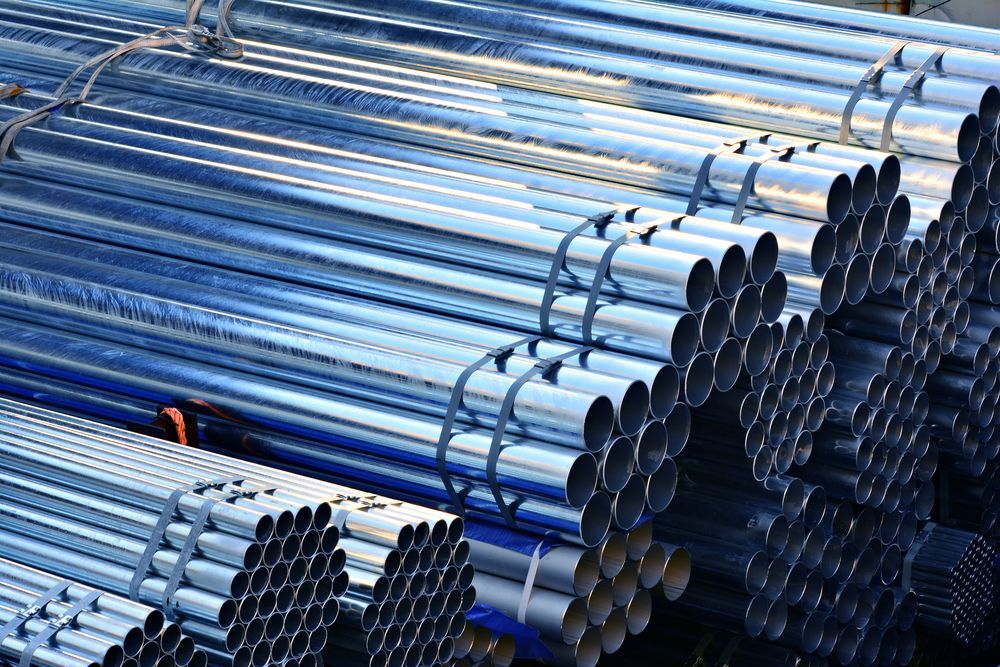 Bundles of Shiny, Cylindrical, Galvanized Metal Pipes — Real Engineering in Wetherill Park, NSW