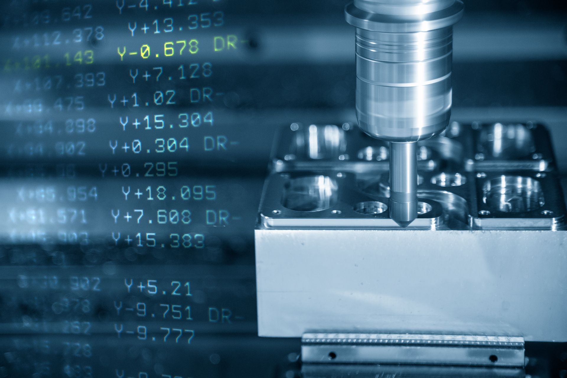 CNC machine cutting a metal block with blue digital data overlay in a factory setting — Real Engineering In Gosford, NSW