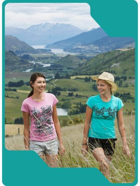 Two people hiking in a mountainous valley.