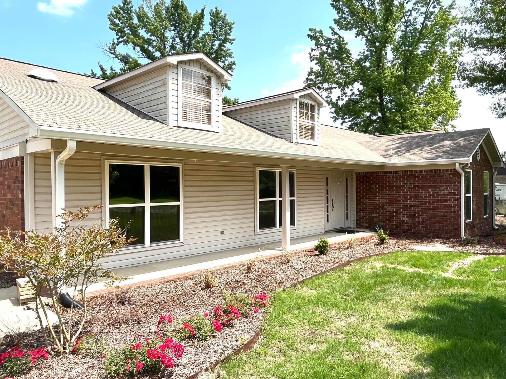 A house with a large porch and a lot of windows
