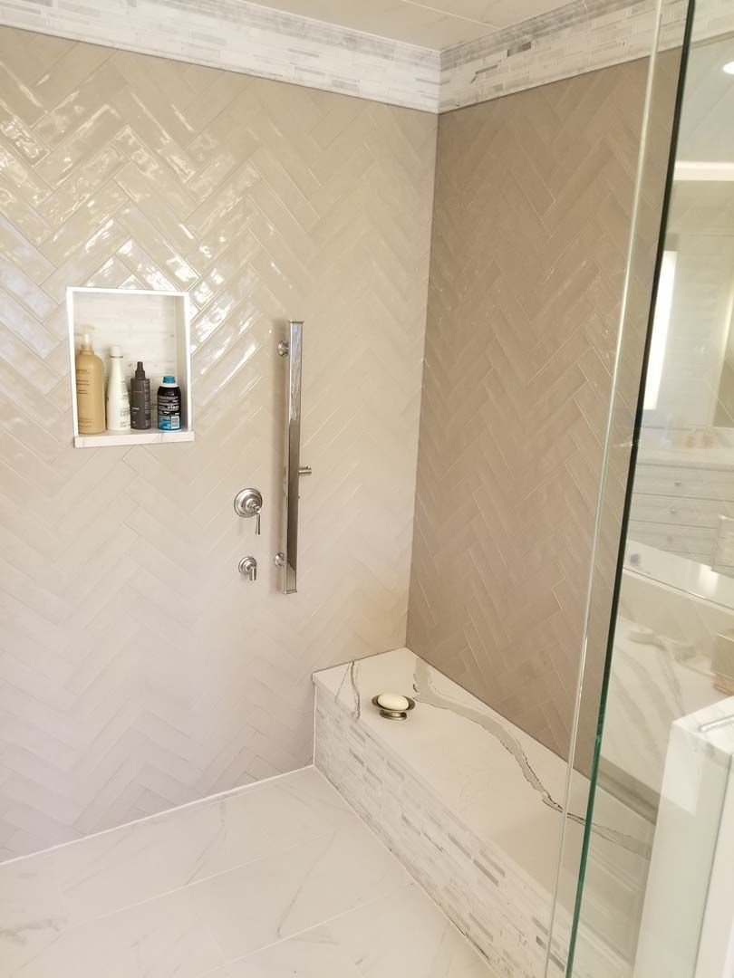 A bathroom with a walk in shower and a bathtub.