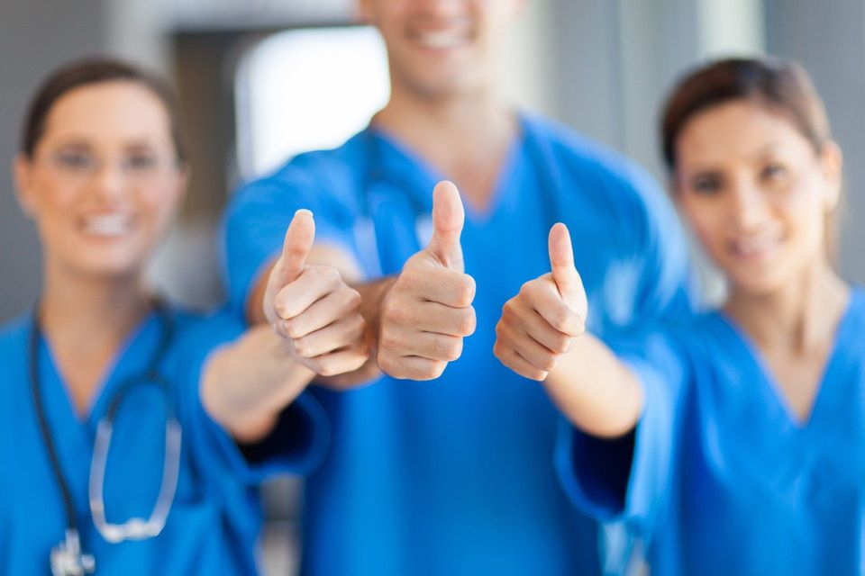 Group Of Healthcare Workers Thumbs Up — Los Angeles, CA — Spiga and Associates