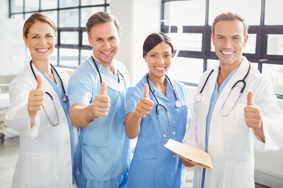 Medical Team Putting Their Thumbs Up And Smiling — Los Angeles, CA — Spiga and Associates